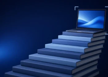 Illustration: a staircase of blue books rising to an open laptop, framed by corner brackets, for a step-by-step guide to becoming an AI trainer