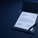 Illustration: a resume sheet in a leather folder with a fountain pen, glasses and ribboned papers, for a domain expert AI resume