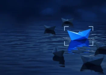 Illustration: small paper boats on dark water with one lit bright blue, for Outlier alternatives