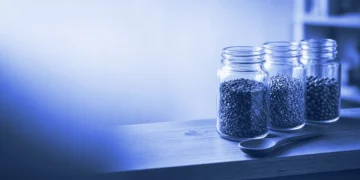 Three spice jars on a shelf beside a wooden spoon, for how an AI trainer can choose a domain