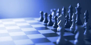 A chessboard mid-game with one knight in focus, for practising fairly for the DataAnnotation Starter Assessment